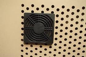 A black square fan on a tan surface

Description automatically generated